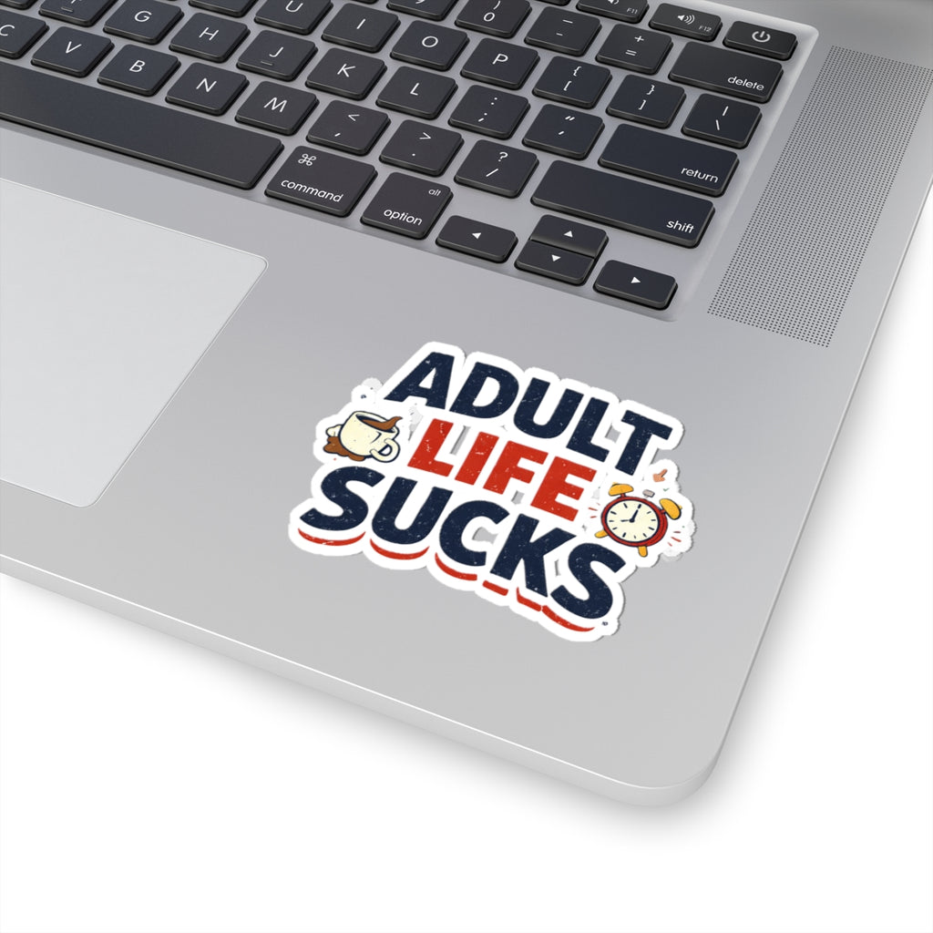 Laptop with a 'Adult Life Sucks' sticker on the palm rest area