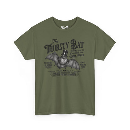 An olive green short-sleeve t-shirt with a vintage-style black graphic of a bat wearing a top hat and the text 'The Thirsty Bat'.