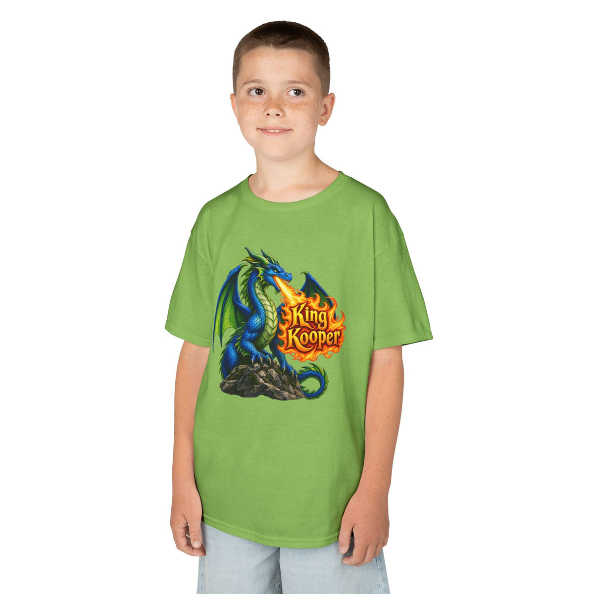 A child wearing a bright green t-shirt with a graphic of a blue dragon and the text 'King Kooper' in orange and yellow, set against a plain white background.