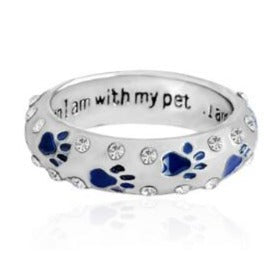 Capture the heartwarming bond between you and your furry best friend with our Dog Paw Prints Jewels Ring. This beautifully crafted ring features delicate paw prints, representing the unbreakable connection between you and your beloved dog. A must-have for any dog lover, this ring makes the perfect accessory to express your love and devotion.