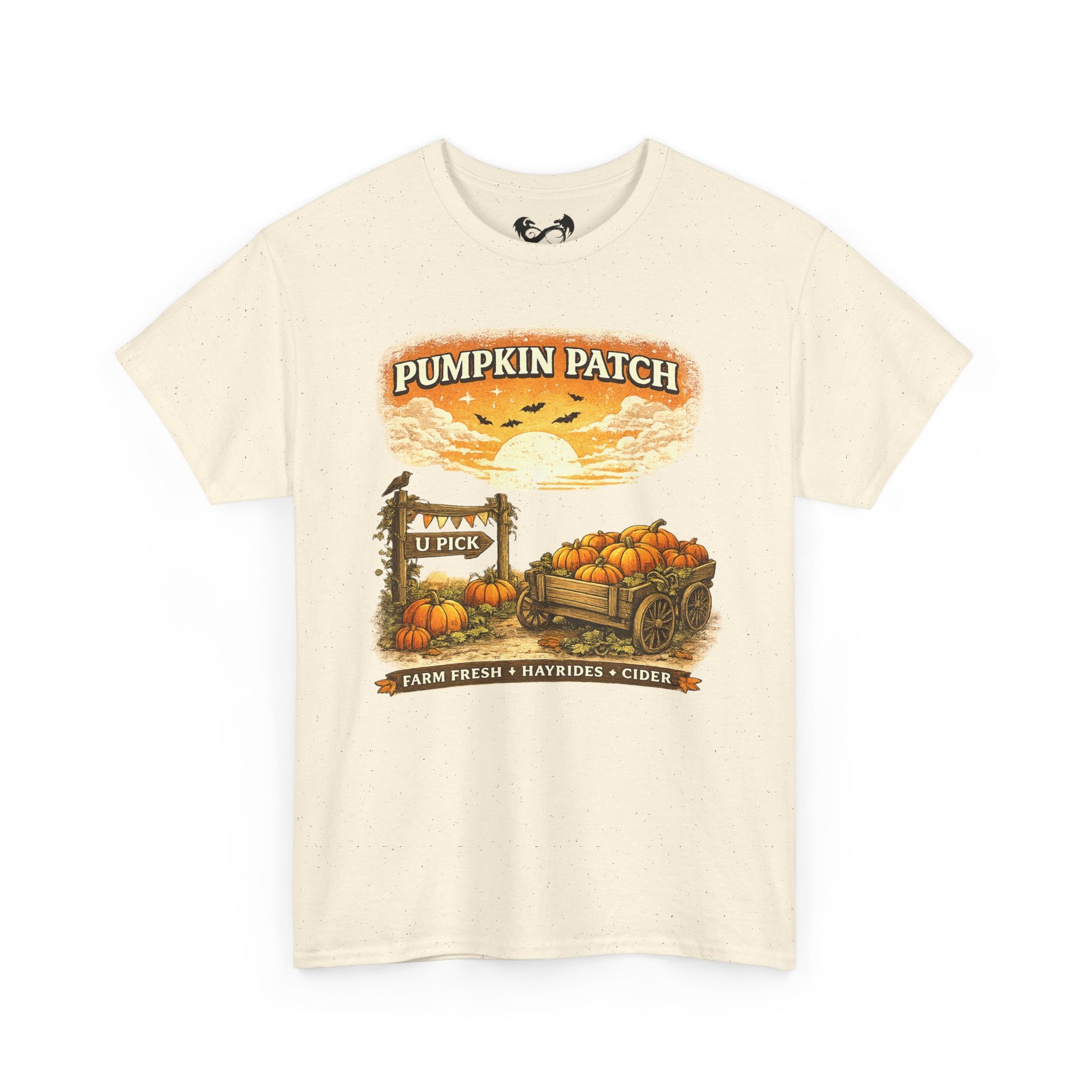 An off-white short-sleeve t-shirt with a vintage-style autumn graphic on the front that reads 'Pumpkin Patch' above a sunset scene with pumpkins, a wagon, and a sign.