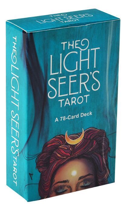 Box of 'The Light Seers Tarot' with a stylized illustration of a woman's face and a crescent moon on a blue background.