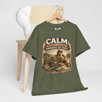 Green t-shirt with graphic design and text on a wooden chair against a white background