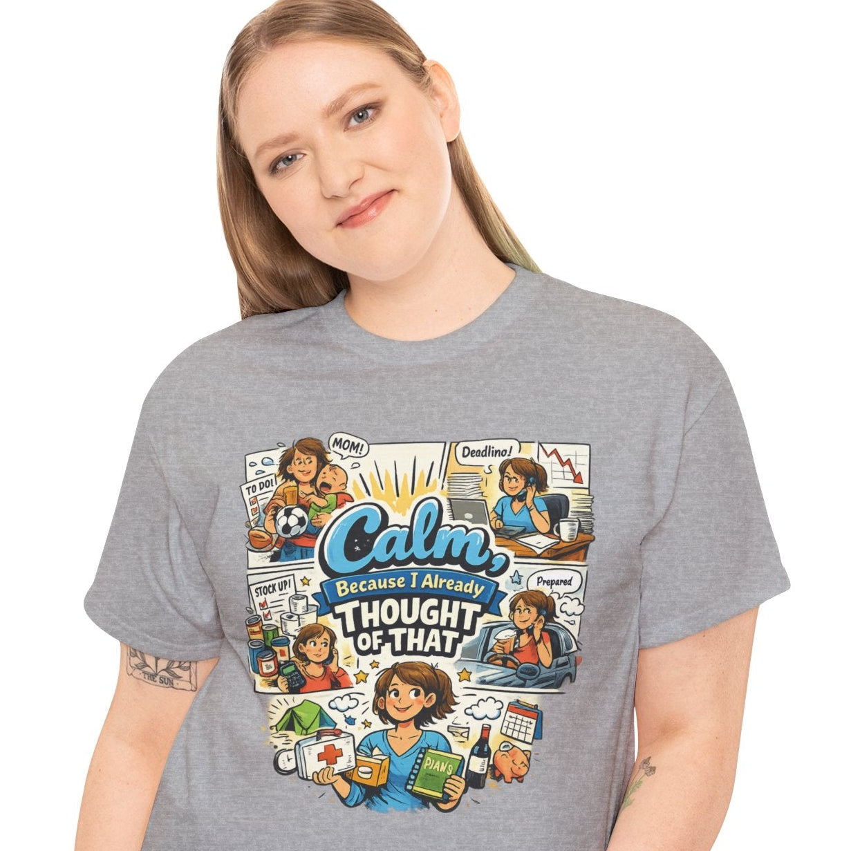 Person wearing a gray t-shirt with a colorful graphic design on a white background