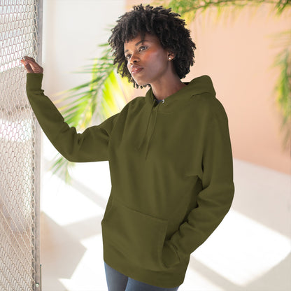 Person wearing a green hoodie with a blue flower design outdoors