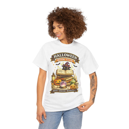 A woman with curly brown hair wearing a white graphic t-shirt with a 'Halloween Moon Club' design, paired with light blue jeans, against a plain white background.