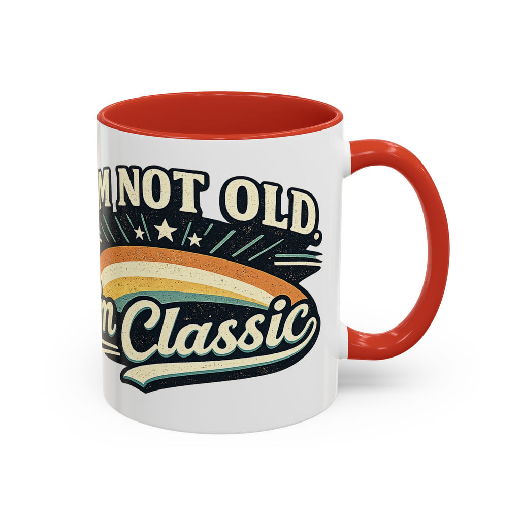 White mug with red interior and handle, featuring a retro design and text.