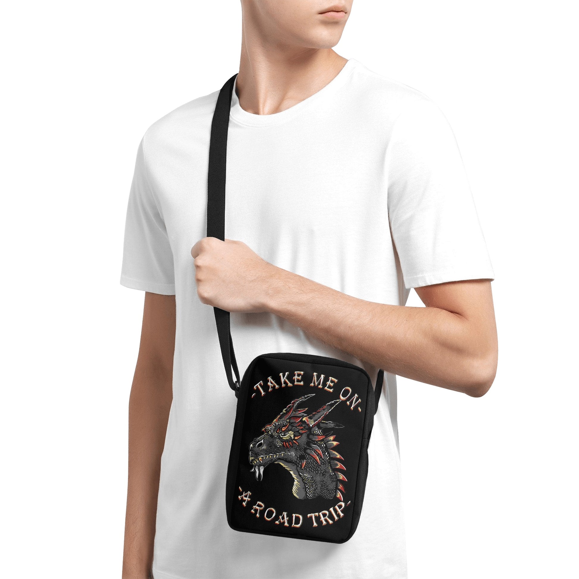 Take your style on the go with the Dragon Road Trip Cross-Body Bag, featuring bold dragon iconography and a spacious interior. This stylish bag has adjustable straps, so you can find your perfect fit effortlessly, while the secure zip-fastening will keep your items safe