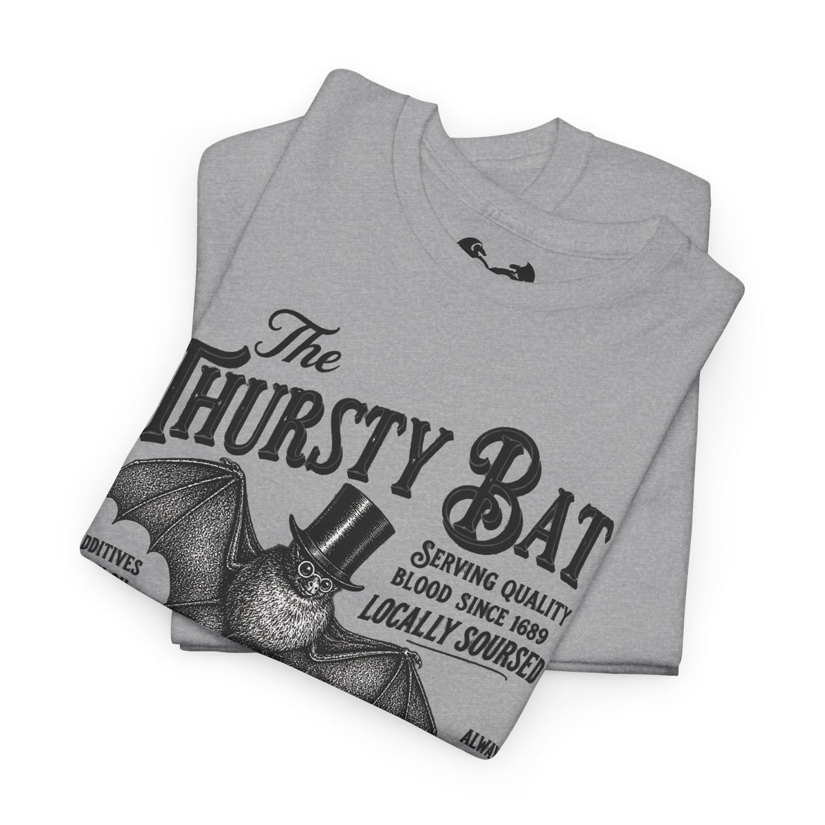 A folded light gray heather t-shirt featuring a vintage-style black graphic of a bat wearing a top hat with the text 'The Thirsty Bat' and 'Serving quality blood since 1689'.
