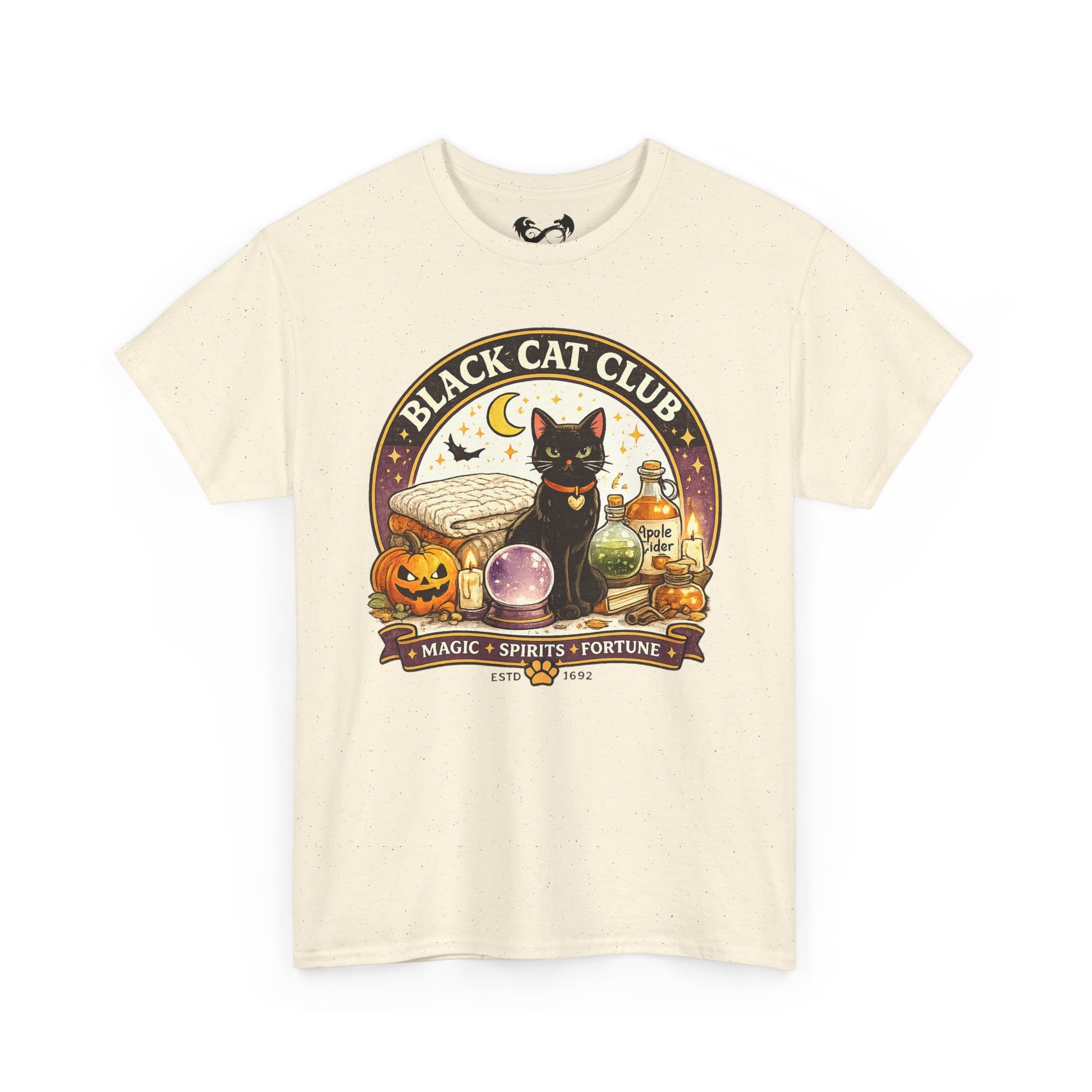 An off-white short-sleeve t-shirt with a detailed graphic on the front. The graphic features a black cat sitting next to a crystal ball, a jack-o'-lantern, a potion bottle, and a banner that reads 'BLACK CAT CLUB' with 'MAGIC - SPIRITS - FORTUNE' below it.