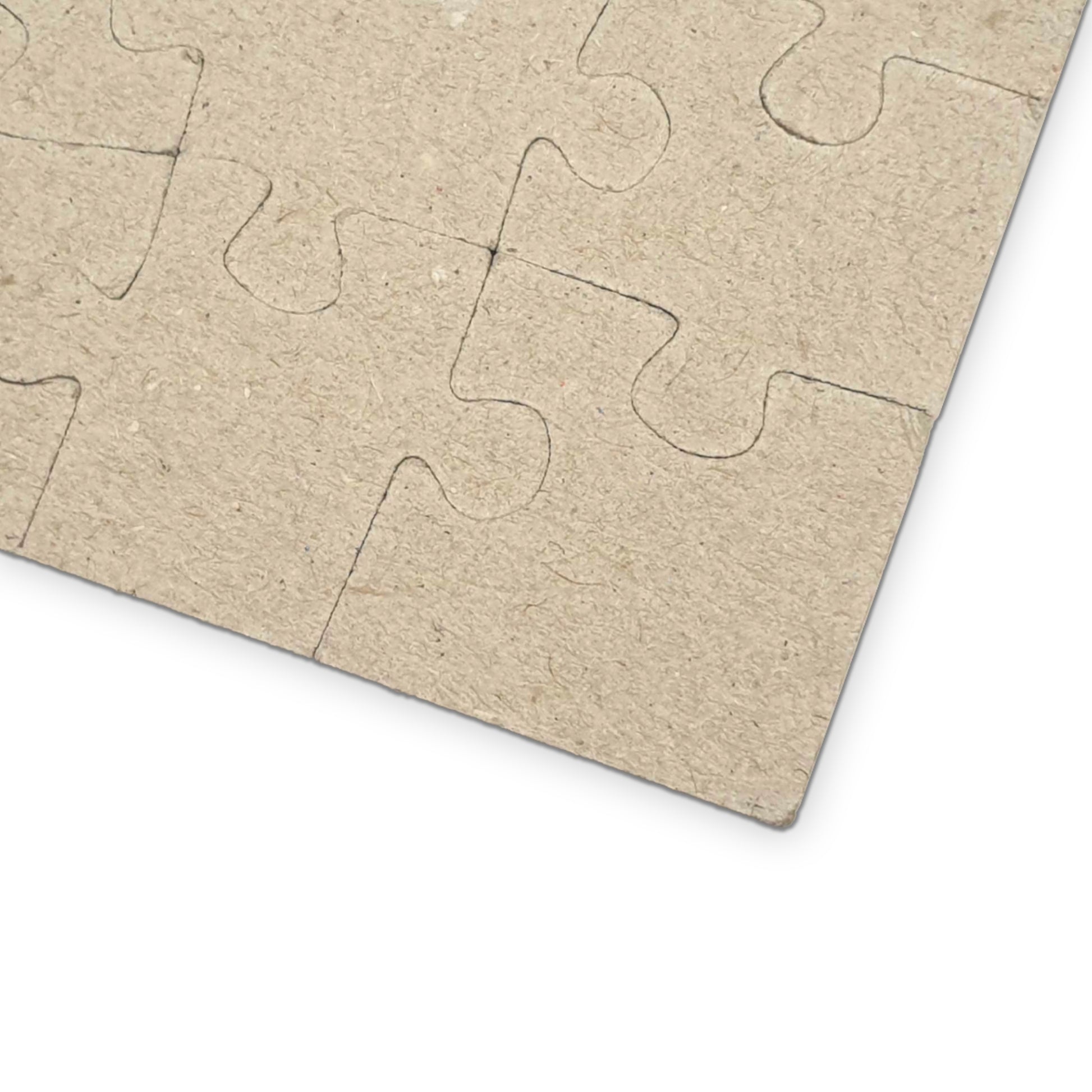 Cardboard puzzle pieces on a white background