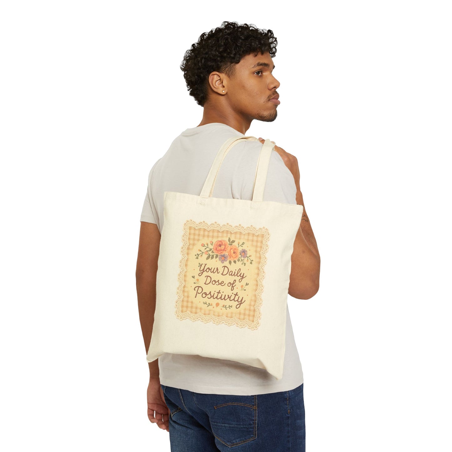 Man carrying a tote bag with text and floral design on a white background