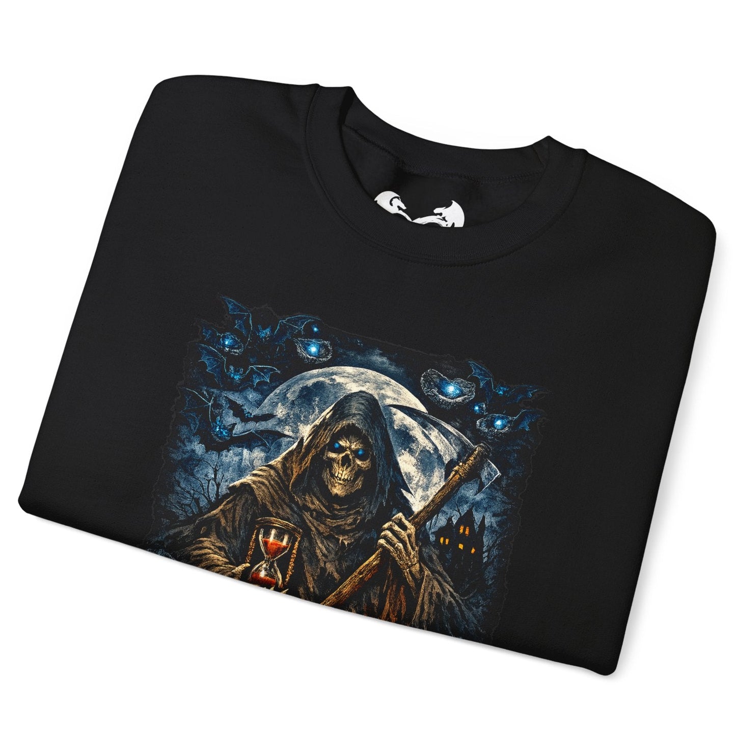 A black folded t-shirt with a detailed graphic print of a grim reaper holding a scythe in front of a full moon, surrounded by blue cats, shown on a plain white background.