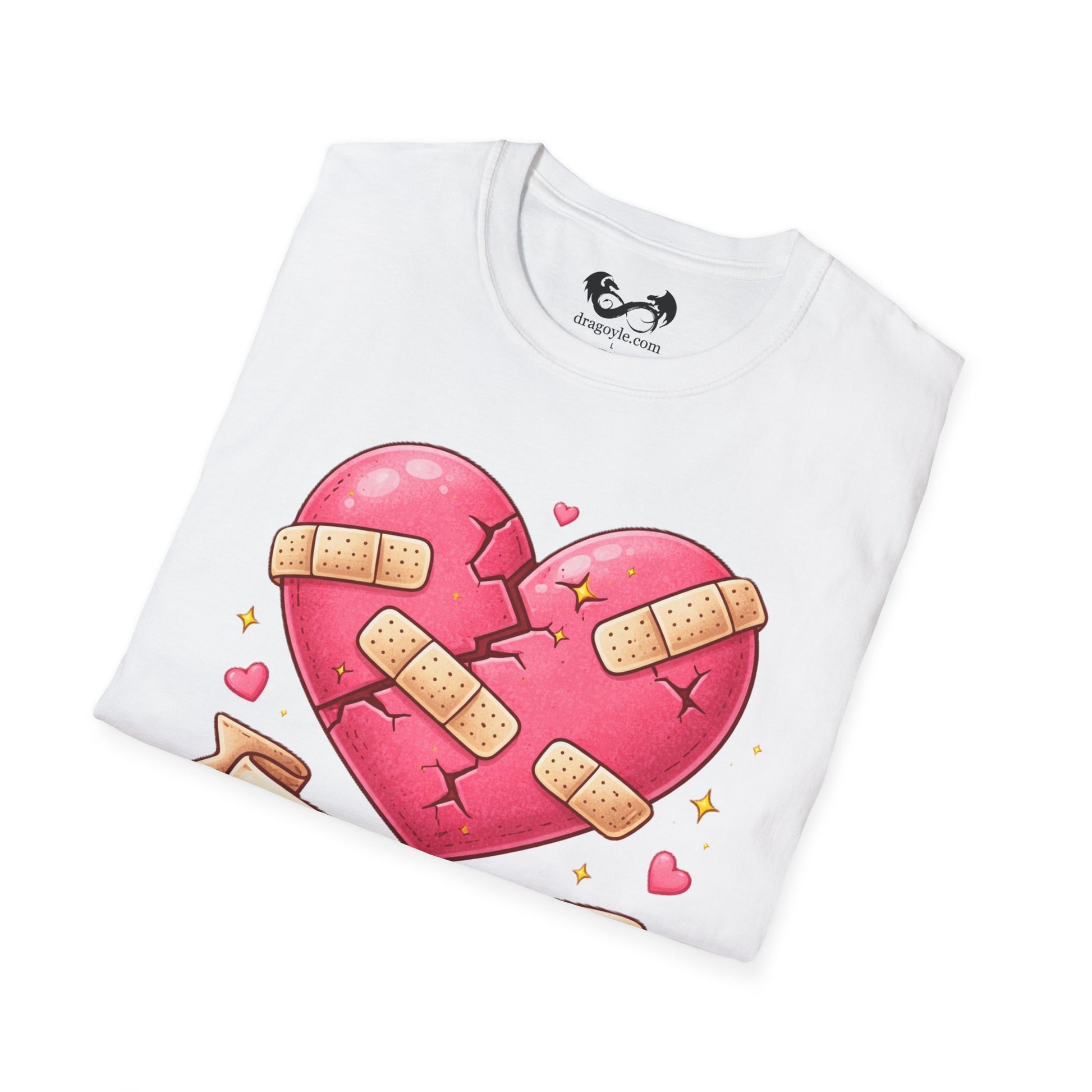 White t-shirt with a pink heart design featuring band-aids on a white background