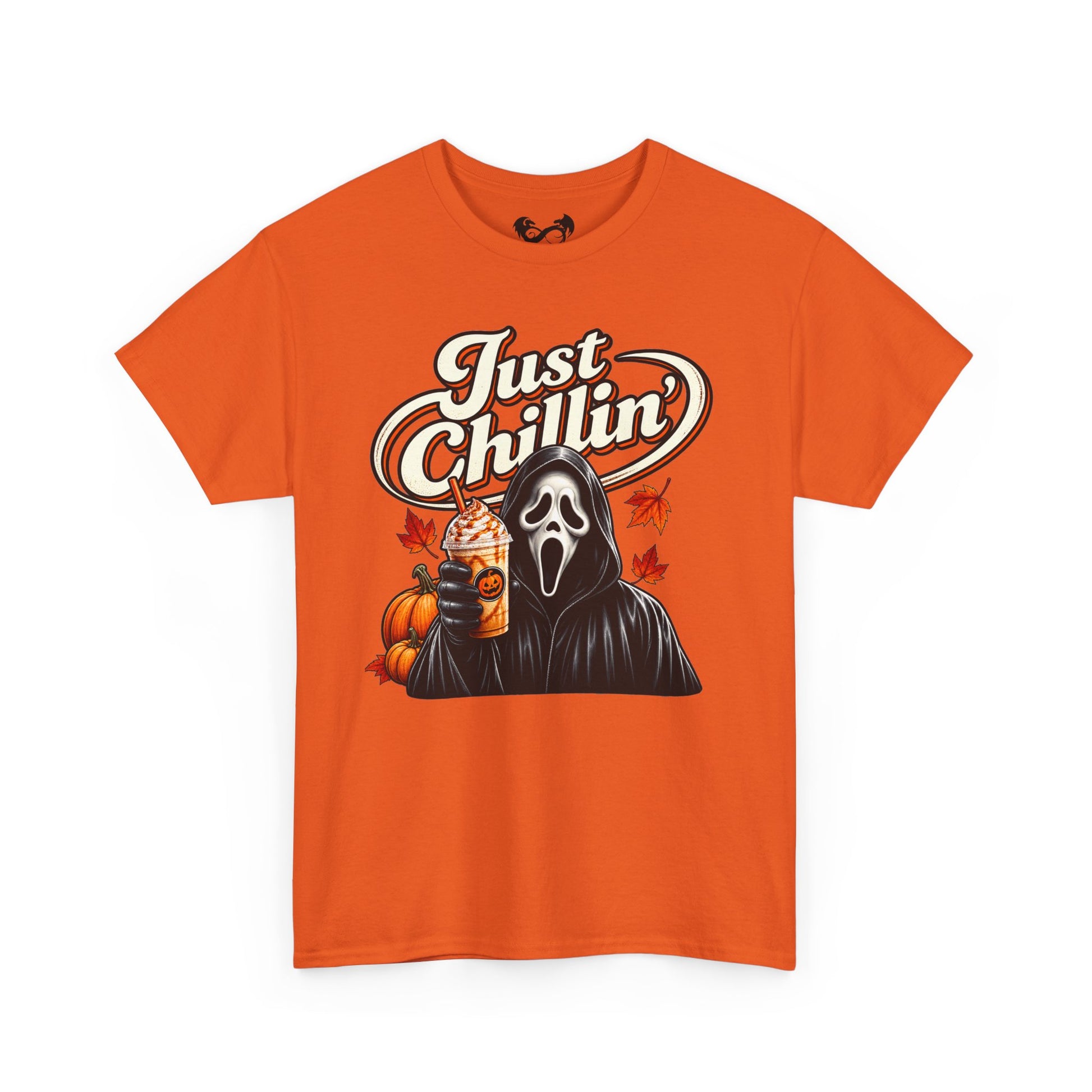 An orange short-sleeve crewneck t-shirt featuring a Halloween graphic of Ghostface holding a drink with pumpkins and the text 'Just Chillin'' on the front, displayed against a solid white background.