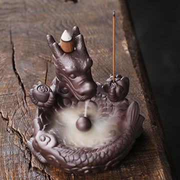 This beautiful Small Dragon Back Flow Incense Burner is a perfect addition to any home. Crafted with intricate details and made from durable material, this incense burner will create an enchanting atmosphere in any room. 