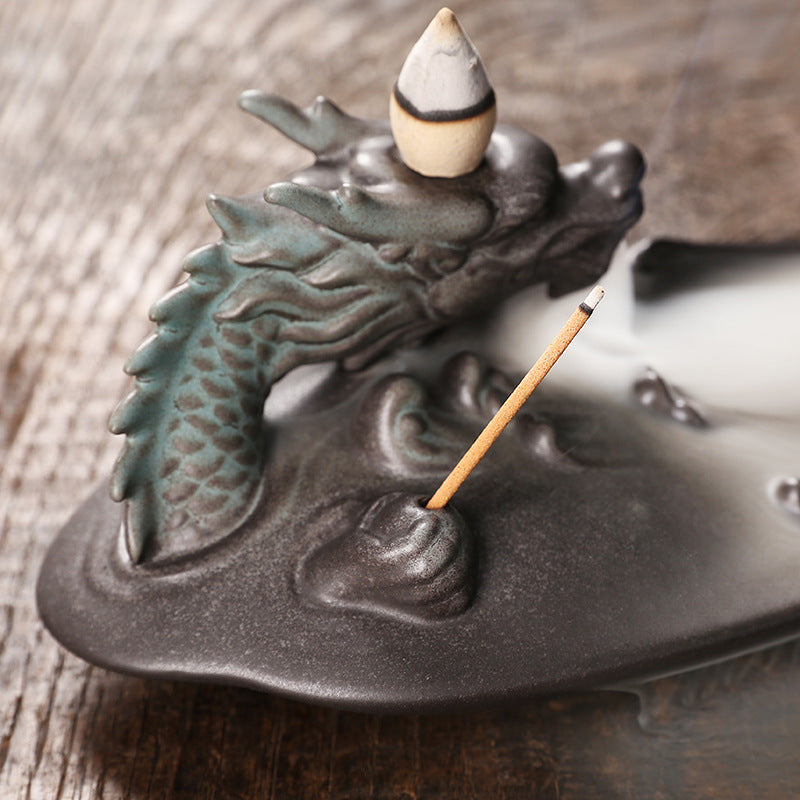 Create a soothing and relaxing ambiance with our Ceramic Aromatherapy Dragon Backflow Burner. This beautifully crafted burner not only adds a touch of elegance, but also helps to purify the air and promote a sense of calm with its backflow feature. Perfect for any home or office space.