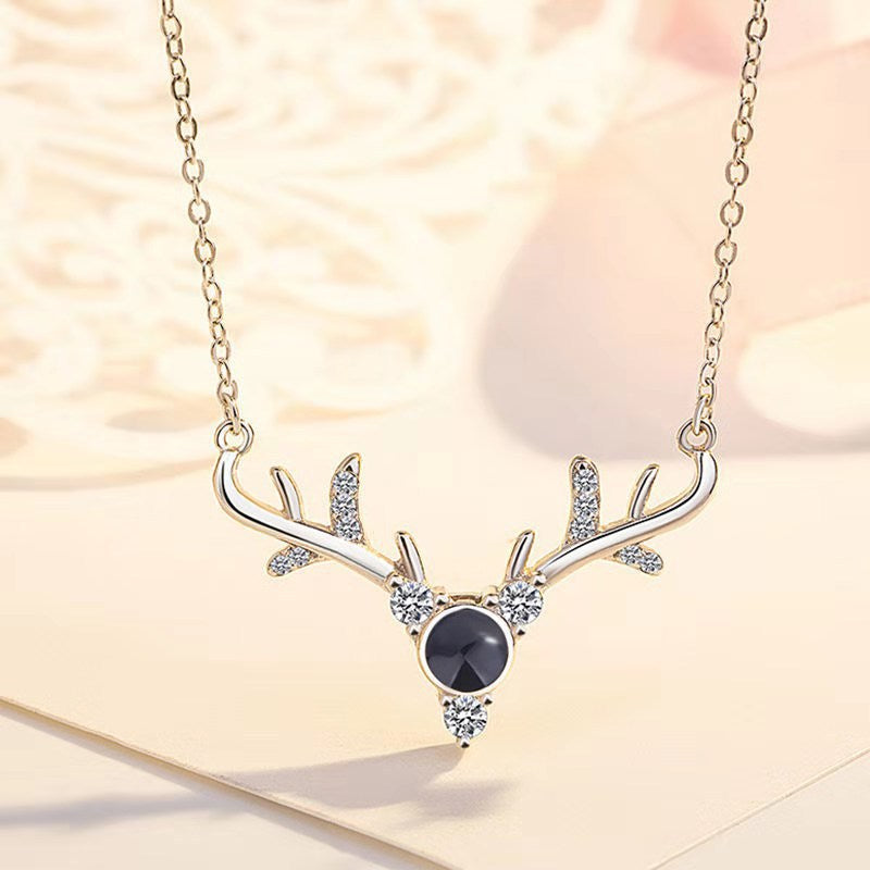 0f3a5c29225574bd384d476525173964 Elevate your holiday style with our Magical 100 "I Love You" Christmas Deer Necklace. Designed to enchant and delight, this necklace features a unique Christmas deer charm and a powerful reminder of love with our "I Love You" message hidden within the charms.