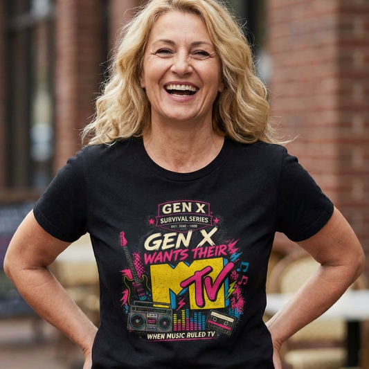 Woman wearing a black t-shirt with colorful graphics and text, standing outdoors.