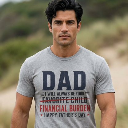 Man wearing a gray t-shirt with a humorous Father's Day message in a natural setting.