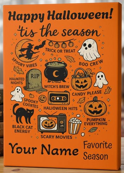 An orange personalized canvas print with Halloween-themed illustrations and text, standing on a wooden table next to a stack of books in a cozy living room setting.