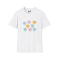 White t-shirt with colorful candy heart graphics on a white background
