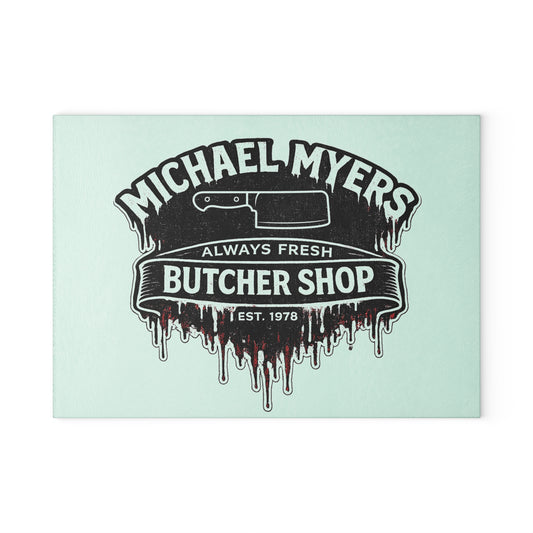 Bring a chilling touch of horror-inspired style to your kitchen with the Michael Myers Butcher Shop Glass Cutting Board. Designed for fans of classic slasher movies and spooky kitchen décor, this bold cutting board combines everyday functionality with a dark, Halloween-inspired aesthetic.