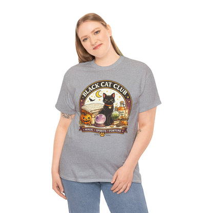 A woman modeling a heather gray t-shirt with a 'Black Cat Club' Halloween graphic featuring a black cat, jack-o'-lantern, and a crystal ball.