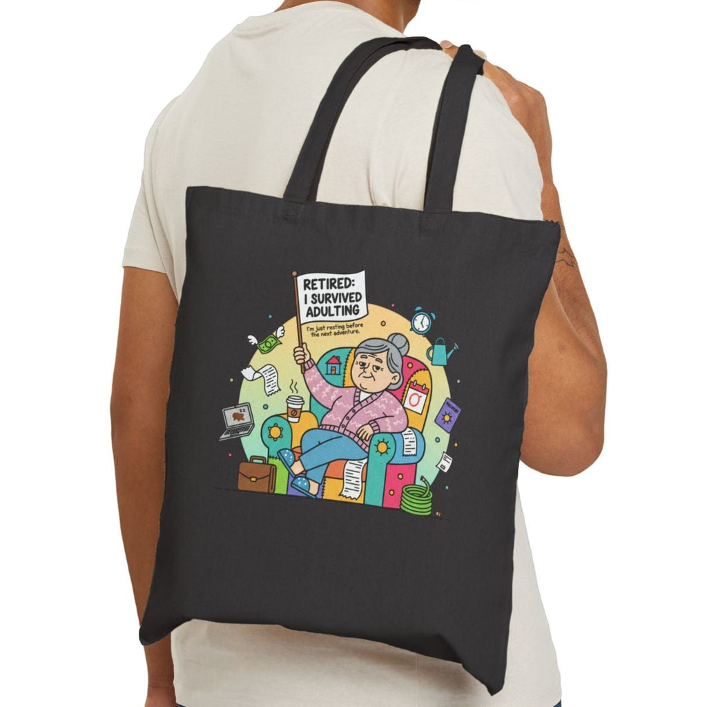 Man carrying a black tote bag with a printed design on a white background