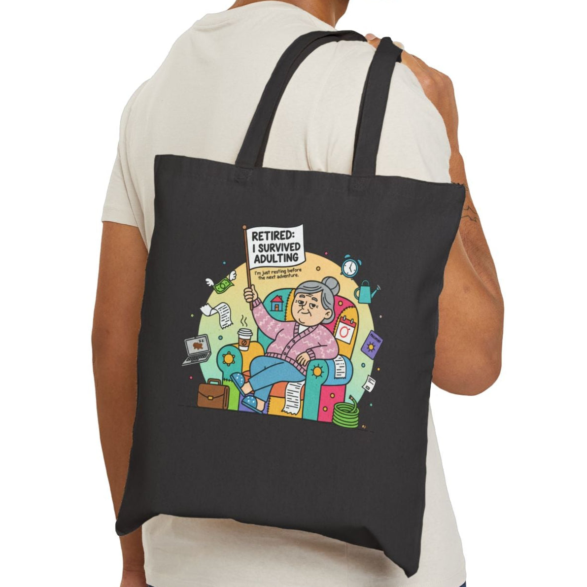 Man carrying a black tote bag with a printed design on a white background