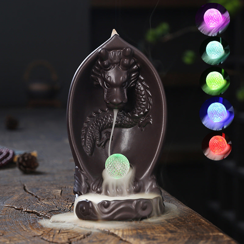 This Creative LED Lamp Backflow Dragon Incense Burner is a unique and eye-catching decoration for any space. Featuring a mesmerizing backflow smoke effect and LED lighting, this burner adds a touch of relaxation and ambiance to any room. 