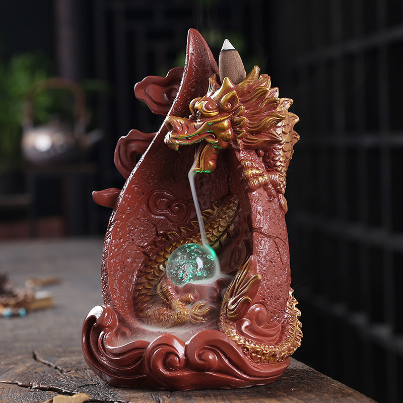 This gorgeous LED Backflow Dragon Incense Burner is handcrafted to instantly add a beautiful, illuminated touch of elegance to your home. Enjoy stunning visual displays while creating a calming atmosphere.