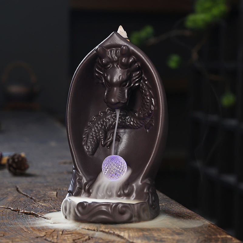 This Creative LED Lamp Backflow Dragon Incense Burner is a unique and eye-catching decoration for any space. Featuring a mesmerizing backflow smoke effect and LED lighting, this burner adds a touch of relaxation and ambiance to any room. 