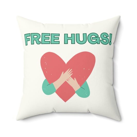 Pillow with a heart design and 'FREE HUGS!' text on a white background