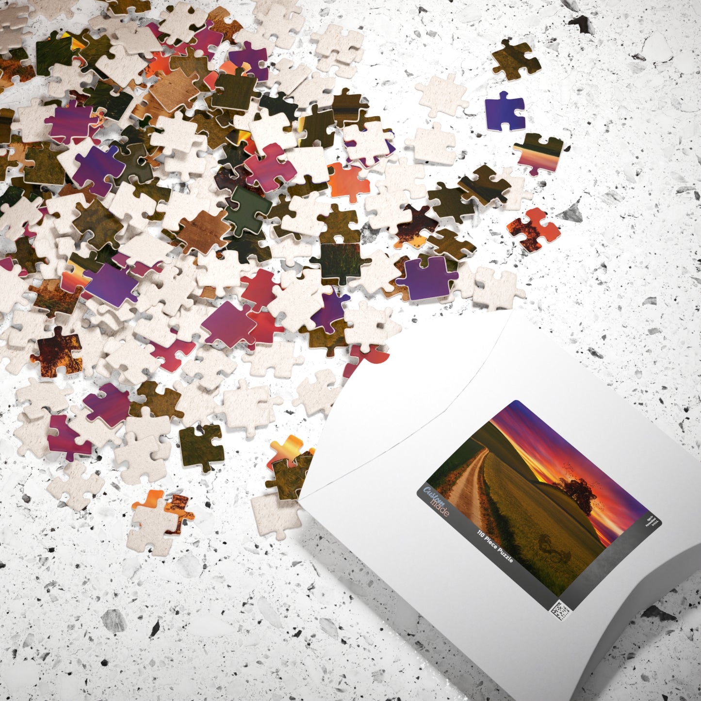 Experience the serene beauty of a country road at sunset with our Country Road Sunset Puzzle. This high-quality puzzle comes with 110 to 1014 pieces, making it perfect for all levels of puzzlers. Each piece fits seamlessly to create a stunning landscape that will provide hours of relaxation and enjoyment.