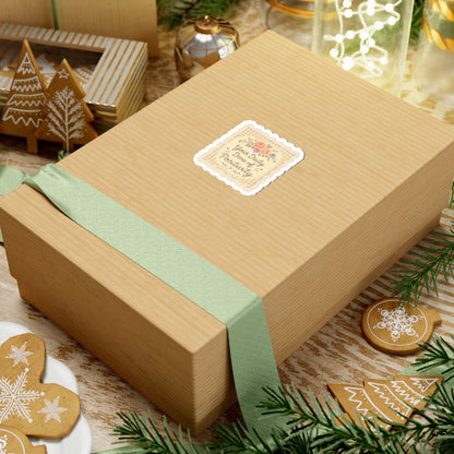 Gift box with a green ribbon on a festive background with cookies and decorations