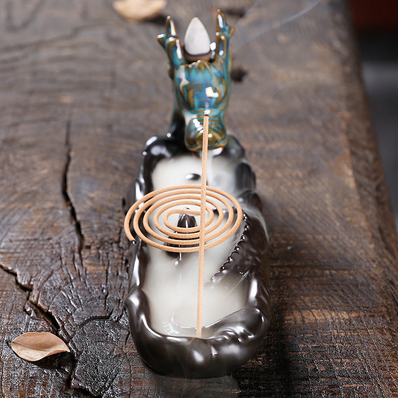 Experience the captivating aroma of burning incense with this stunning Ceramic Backflow Aromatherapy Dragon Incense Burner. Crafted from high-quality ceramic and featuring a majestic dragon design, this incense burner is the perfect way to enhance the atmosphere in any room. 