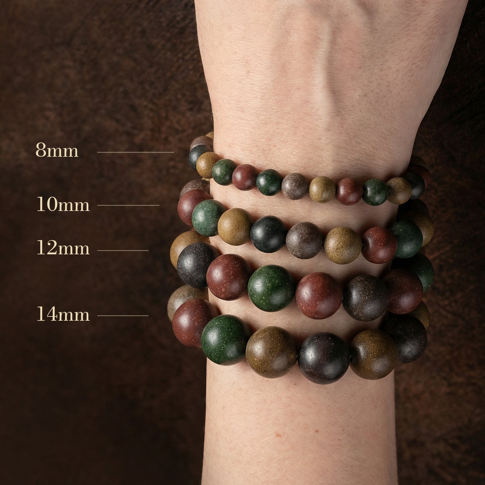Stack of beaded bracelets on a wrist with size labels.