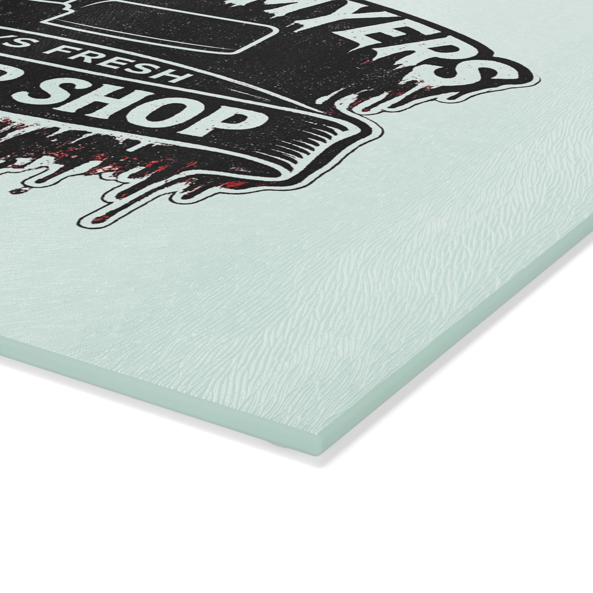 Bring a chilling touch of horror-inspired style to your kitchen with the Michael Myers Butcher Shop Glass Cutting Board. Designed for fans of classic slasher movies and spooky kitchen décor, this bold cutting board combines everyday functionality with a dark, Halloween-inspired aesthetic.
