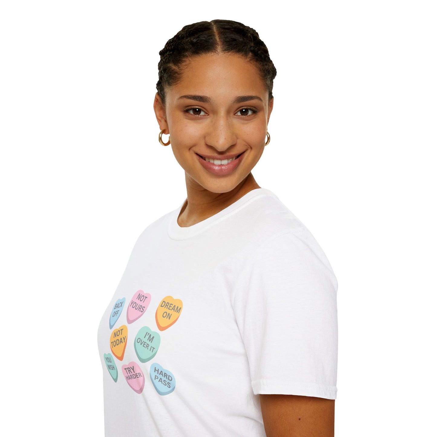 Person wearing a white t-shirt with colorful candy heart designs on a white background