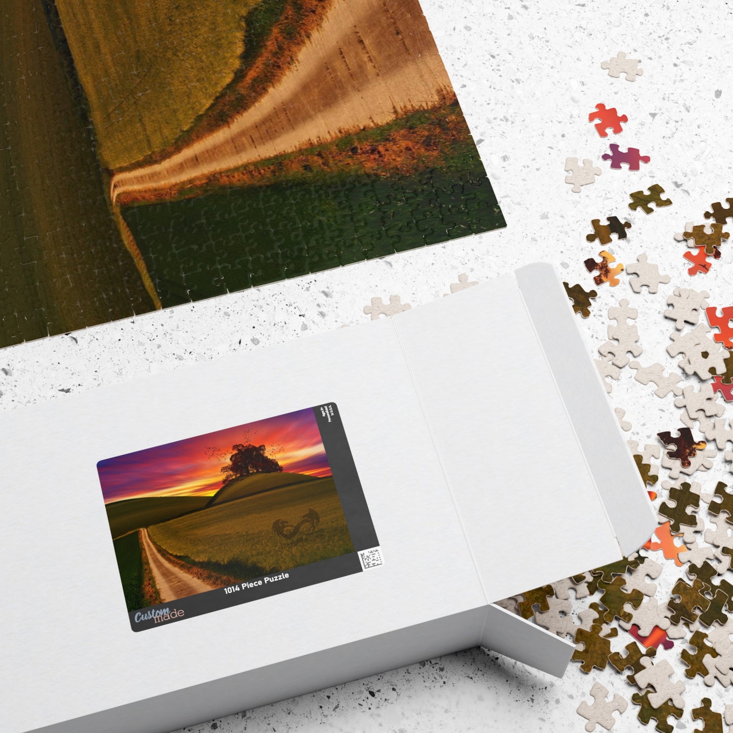 Experience the serene beauty of a country road at sunset with our Country Road Sunset Puzzle. This high-quality puzzle comes with 110 to 1014 pieces, making it perfect for all levels of puzzlers. Each piece fits seamlessly to create a stunning landscape that will provide hours of relaxation and enjoyment.