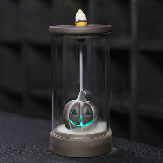 Elevate your Halloween ambiance with the Halloween Pumpkin Backflow Incense Burner. Crafted to create a mesmerizing smoke waterfall effect, it transforms your favorite incense cones into a captivating display.