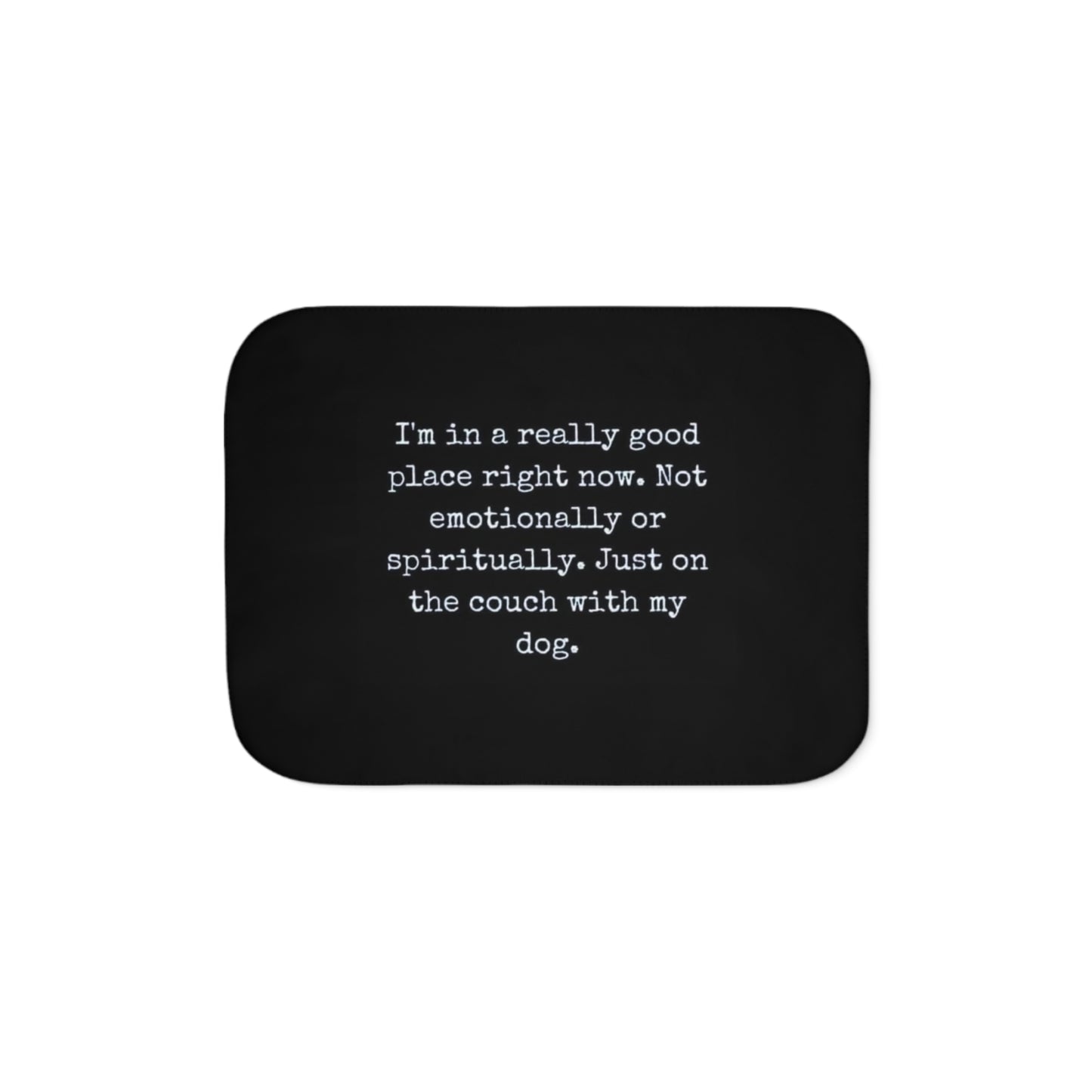 Black mouse pad with white text on a white background