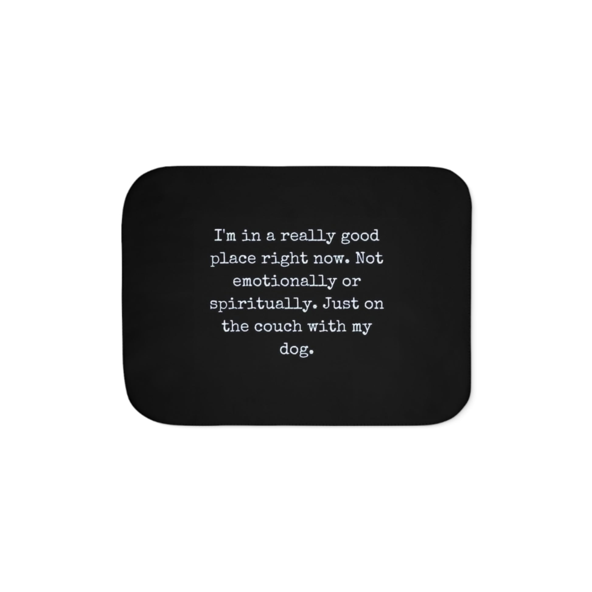 Black mouse pad with white text on a white background
