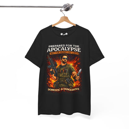 Black t-shirt with graphic design of a person holding weapons and text 'Prepared for the Apocalypse Not for Honey Do Lists Domestic & Dangerous' on a hanger.