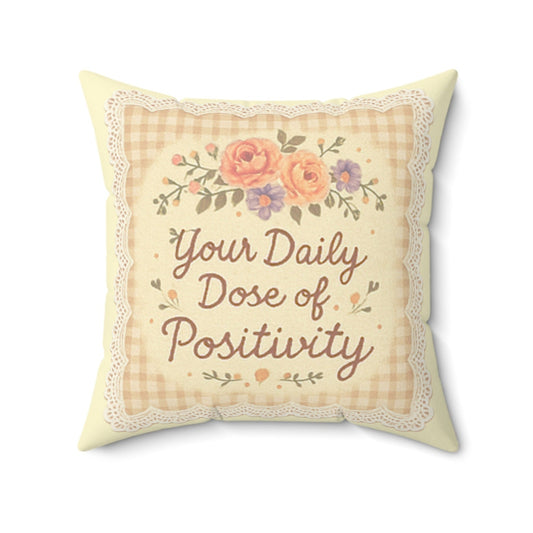 Decorative pillow with floral design and text on a white background