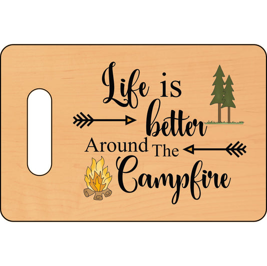 Wooden cutting board with 'Life is better around the campfire' text and camping-themed graphics.
