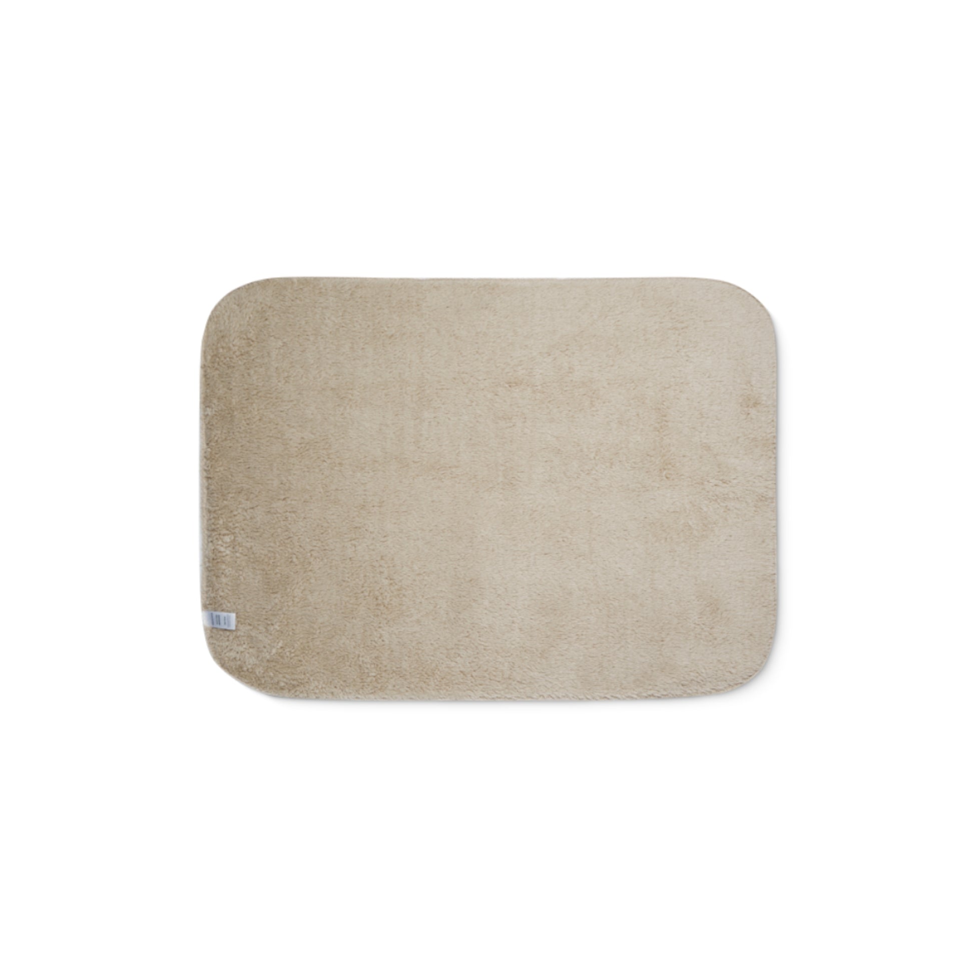 Beige bath mat on a white background
