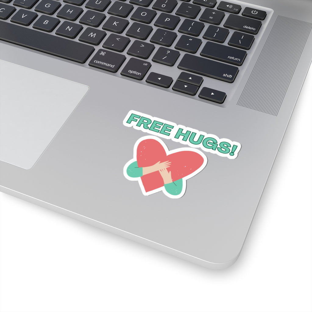 Laptop with a 'FREE HUGS!' sticker on the palm rest area