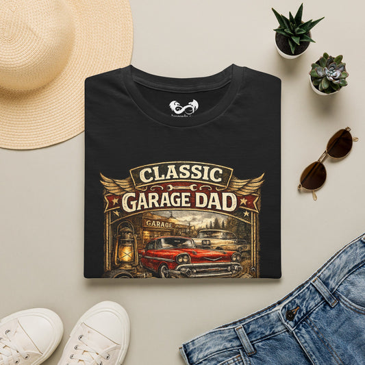 Black t-shirt with 'Classic Garage Dad' design on a light surface with accessories.